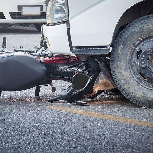 motorcycle on bumper truck
